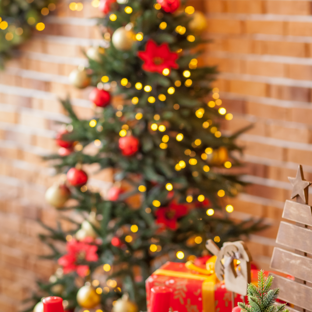 A Christmas tree is decorated with flowers and lights and helps create a special holiday feeling.
