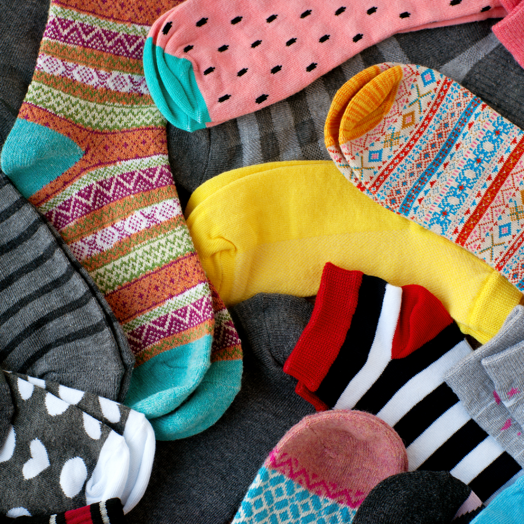 A picture pf brightly colored socks.  Socks always make a great gift or holiday donation.