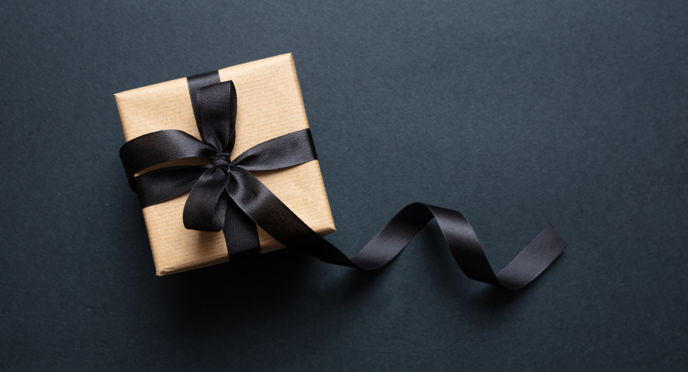 A beautifully-wrapped gift sits and waits to be opened.