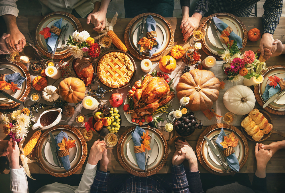 A bountiful thanksgiving dinner sits on a table.